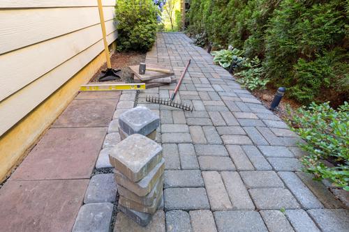 A custom stone walkway, just one of the many option our hardscaping contractors offer